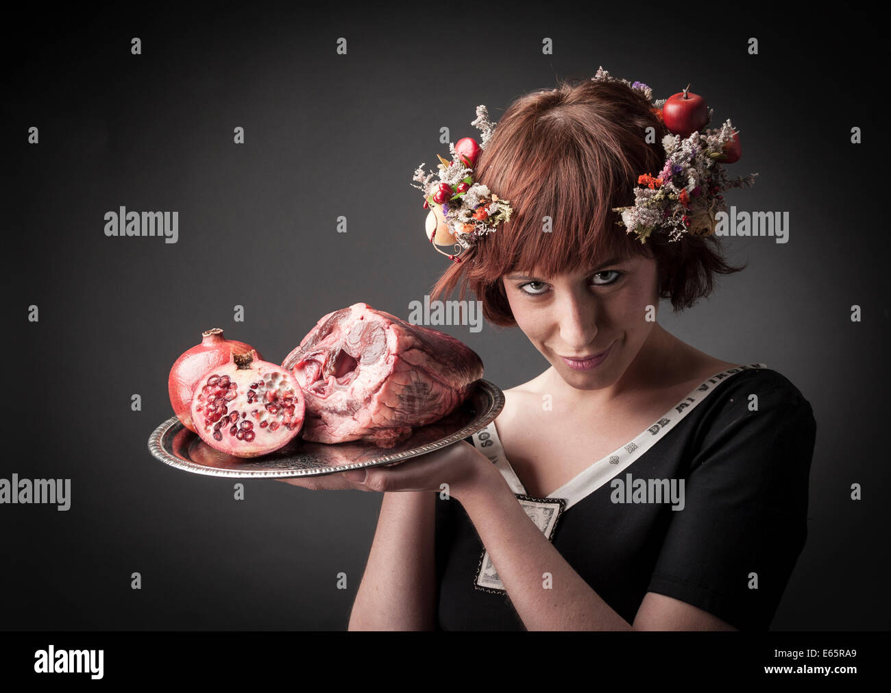 maid serving raw food Stock Photo
