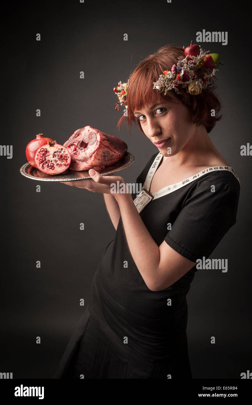 maid serving raw food. Stock Photo