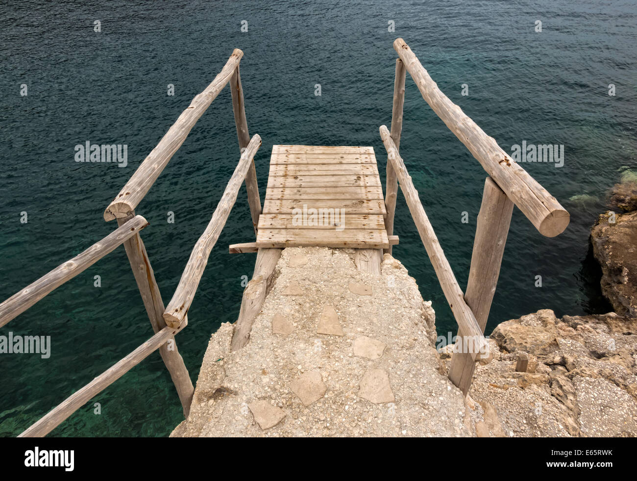 Wooden dock over sea at a seaside cliff Stock Photo