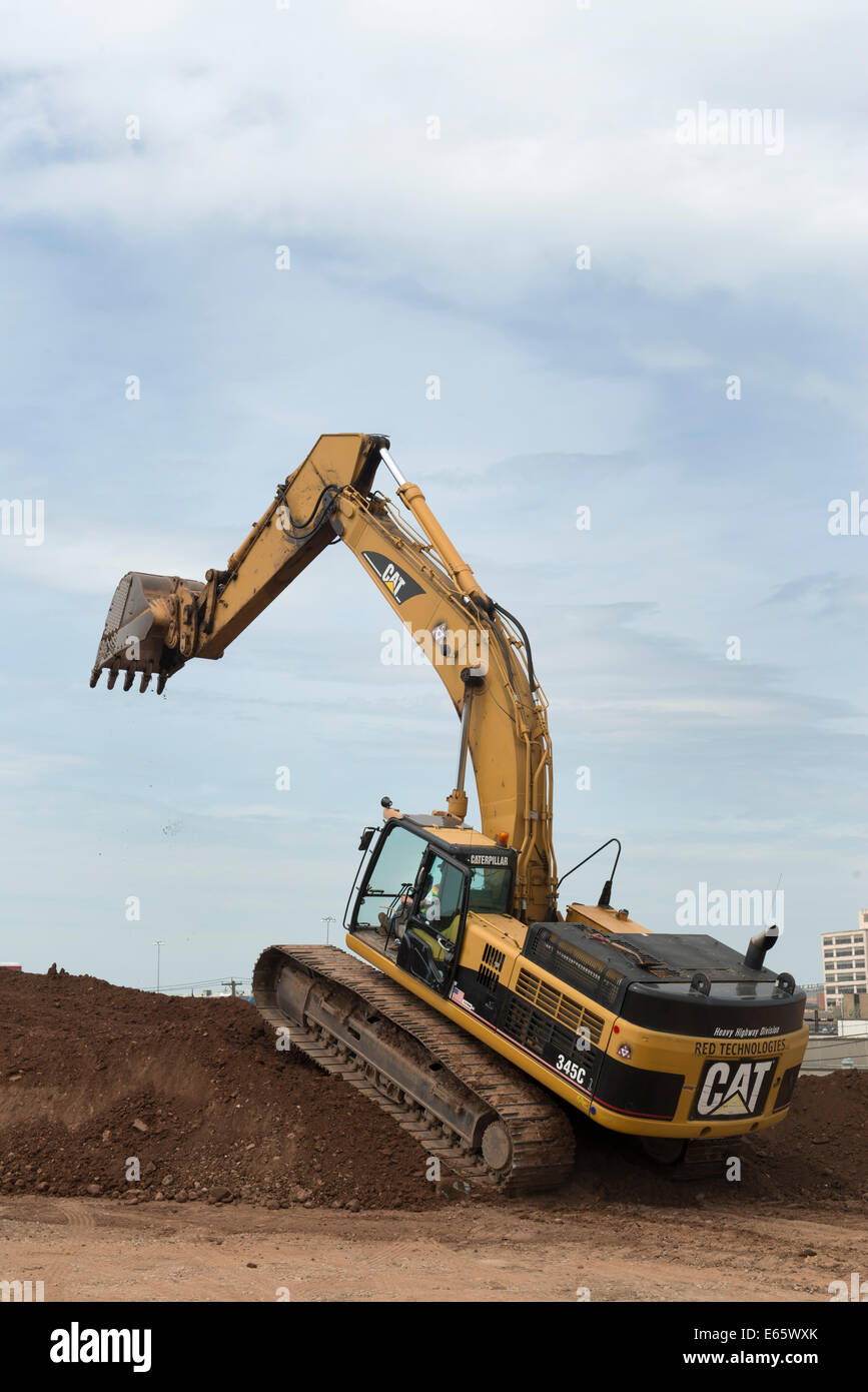 Excavator  working  on I-95 New Haven Harbor Crossing Project re-use pile. Stock Photo