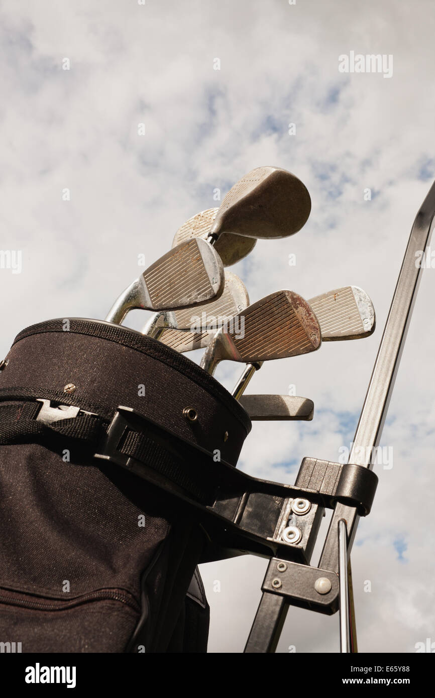 Golf clubs and bag detail with sky background. Stock Photo