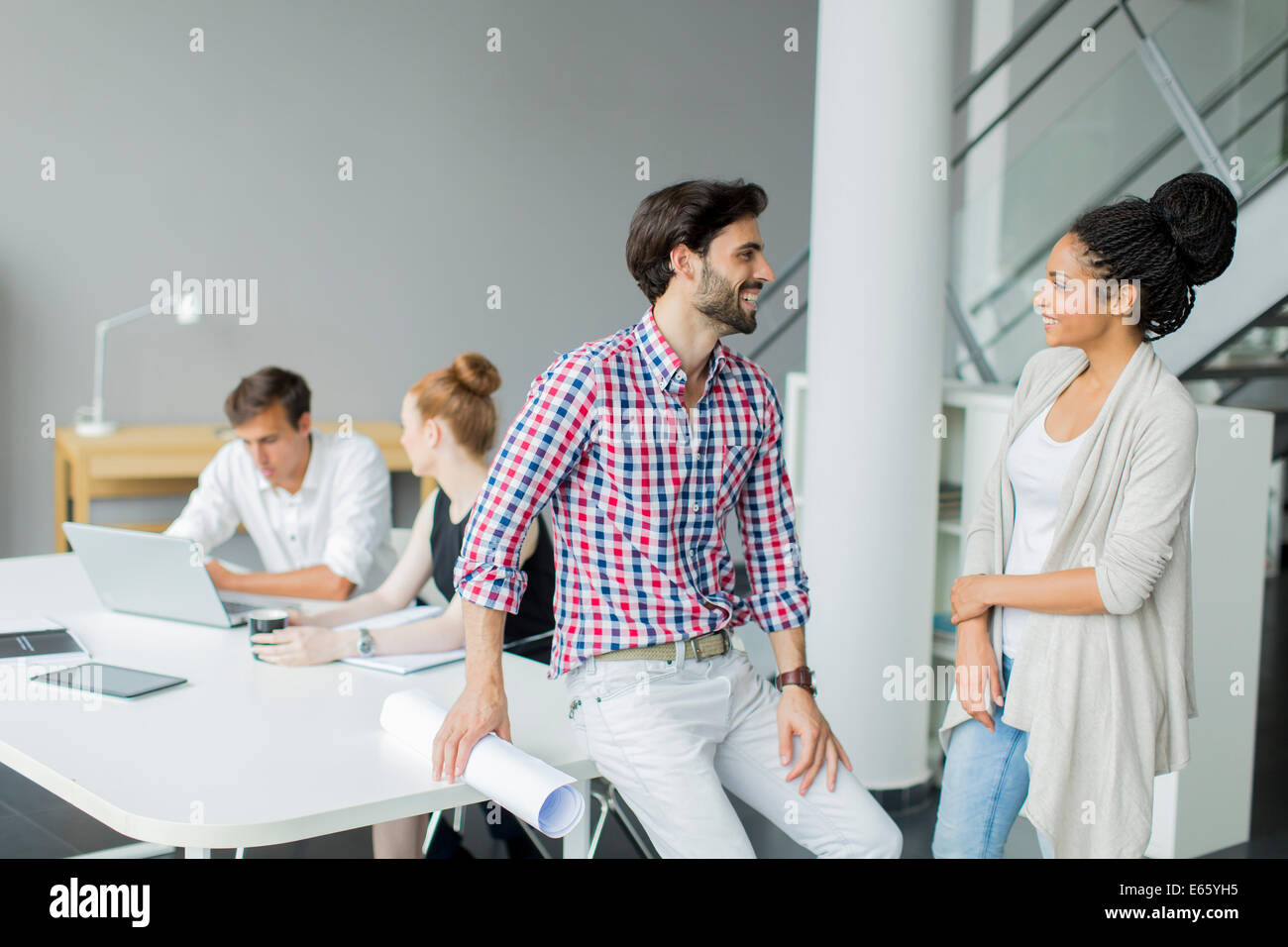 Young people in the office Stock Photo - Alamy