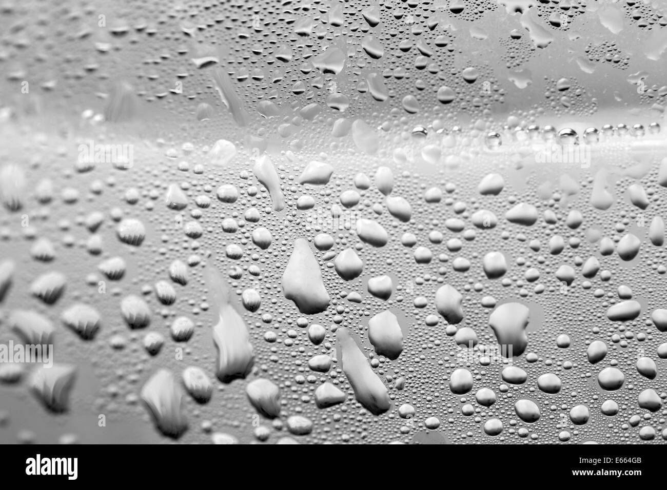 Water drops on gray bottle background Stock Photo