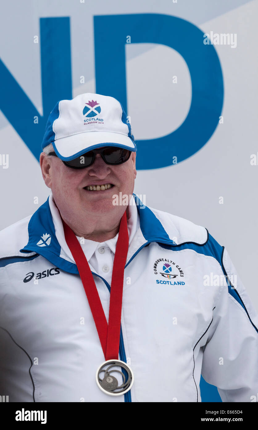 Glasgow, Scotland, UK. 15th Aug, 2014. Robert Conway Commonwealth Games Silver medallist in Lawn Bowls - Para-Sport B2-B3 Mixed Pairs (visually impaired) in George Square, at the end of the parade to salute Team Scotland after Glasgow 2014 - an event attended by Clyde-siders, Host City Volunteers, and the families of the athletes. Stock Photo