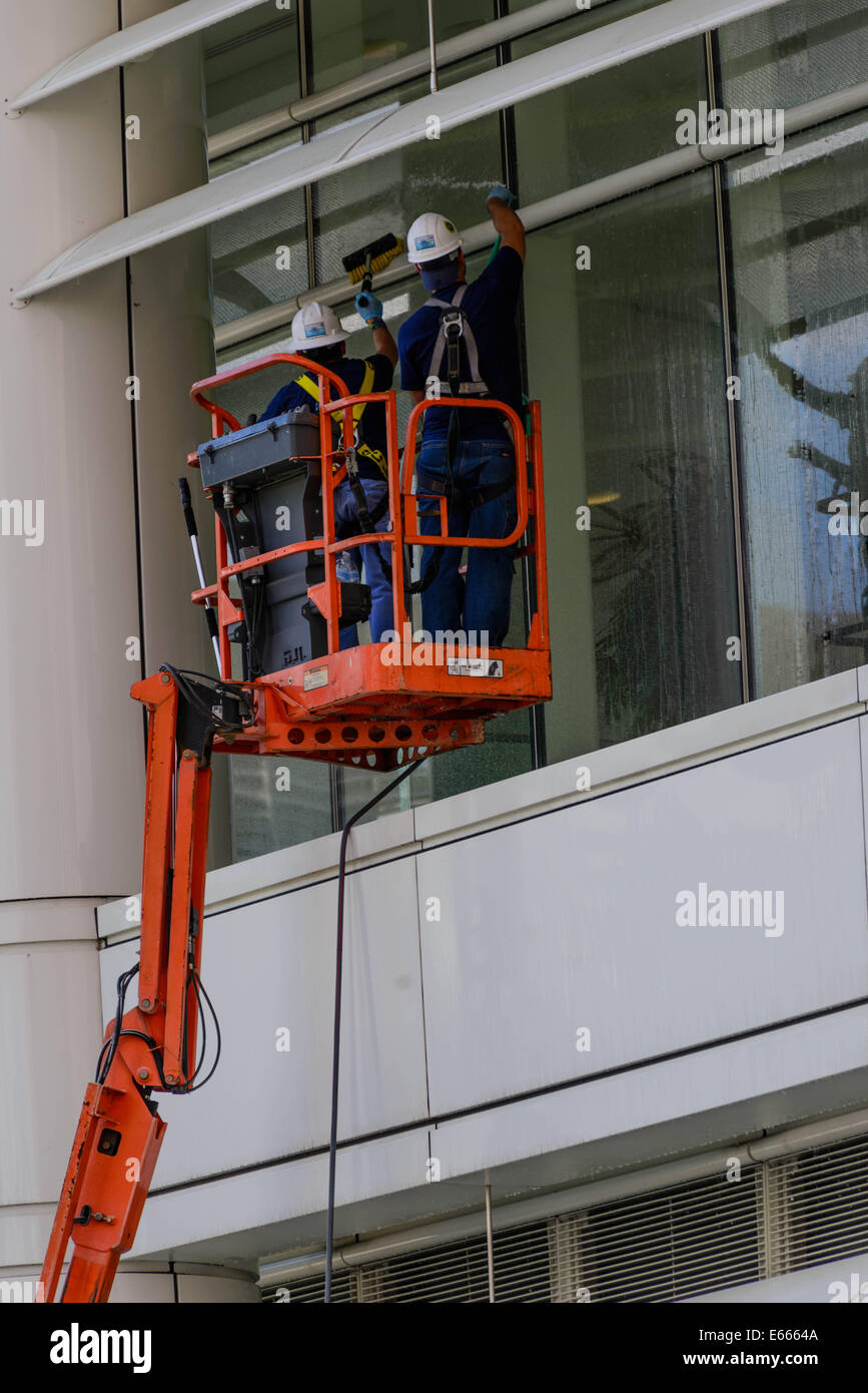 window washing crew on a lift Stock Photo Alamy