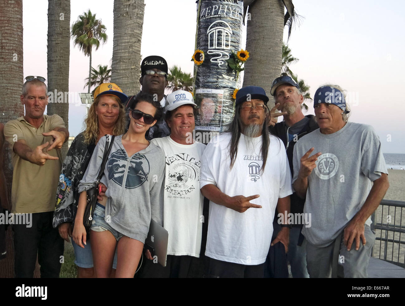 Venice, California, USA. 15th Aug, 2014. A group gathers at Venice Skate Park to pay tribute to original Dogtown Z-Boys skateboarder Jay Adams who passed away on Thursday in Mexico. Jeff Ho, third from right, was a catalyst to help form the Z-boys team at his store Jeff Ho Surfboards and Zephyr Productions in the early 1970's. © Jonathan Alcorn/ZUMA Wire/Alamy Live News Stock Photo