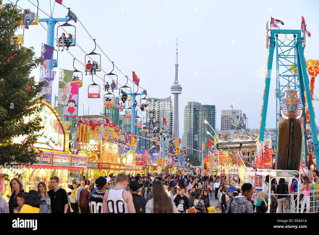 Toronto, Canada. 15th August 2014. Later afternoon view of the CNE Midway and Skyride at the CNE ground on the Opening day of the 136th CNE (Canadian National Exhibition a.k.a. TheEx) in Toronto. Credit:  EXImages/Alamy Live News Stock Photo