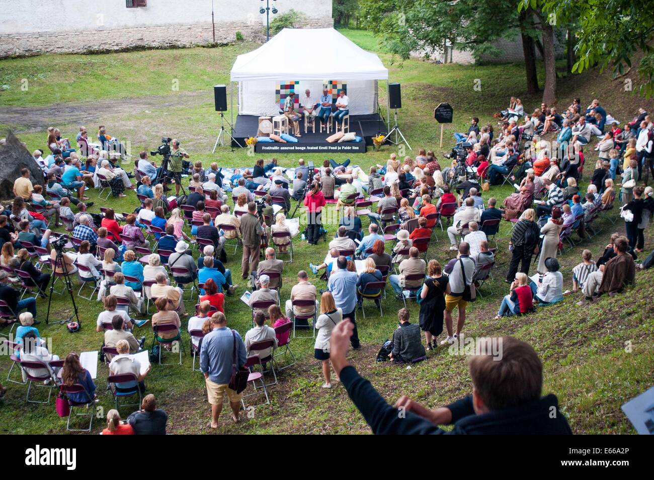 Paide, Estonia. 15th Aug, 2014. People attend a meeting during the