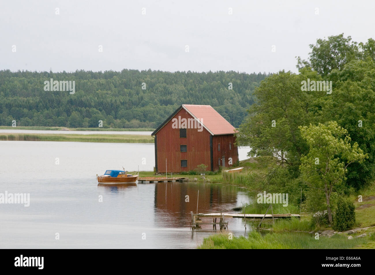 swedish lake lakes sweden boat house red falun paint Stock Photo