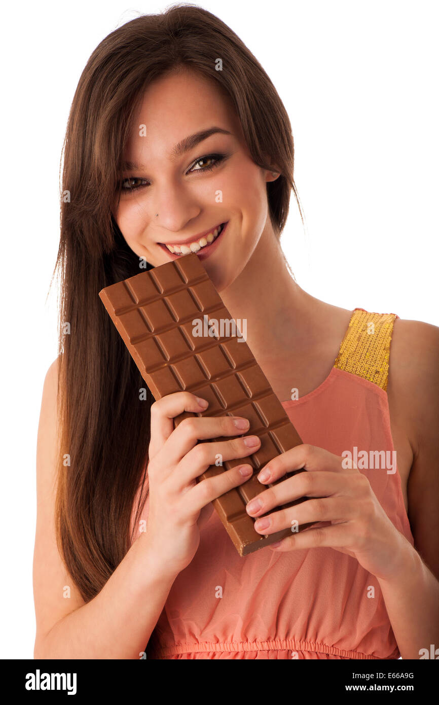 Beautiful young caucasian woman eating chocolate isolated over white background Stock Photo