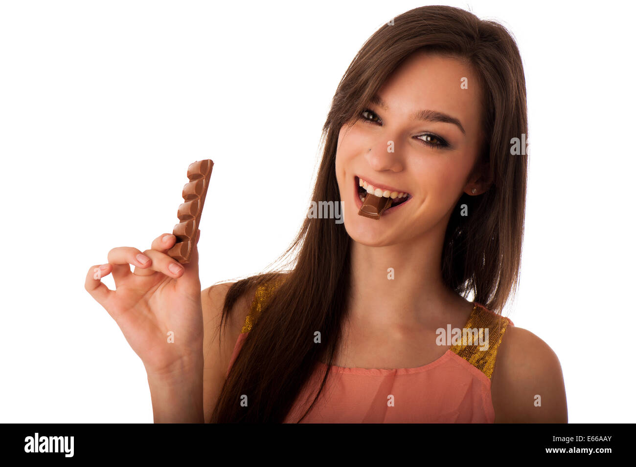 Beautiful young caucasian woman eating chocolate isolated over white background Stock Photo