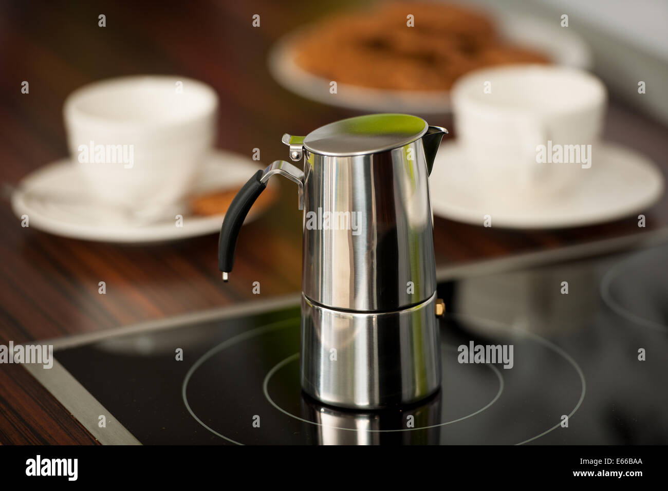 cooking espresso coffee with italian cafetera at home in the morning Stock Photo