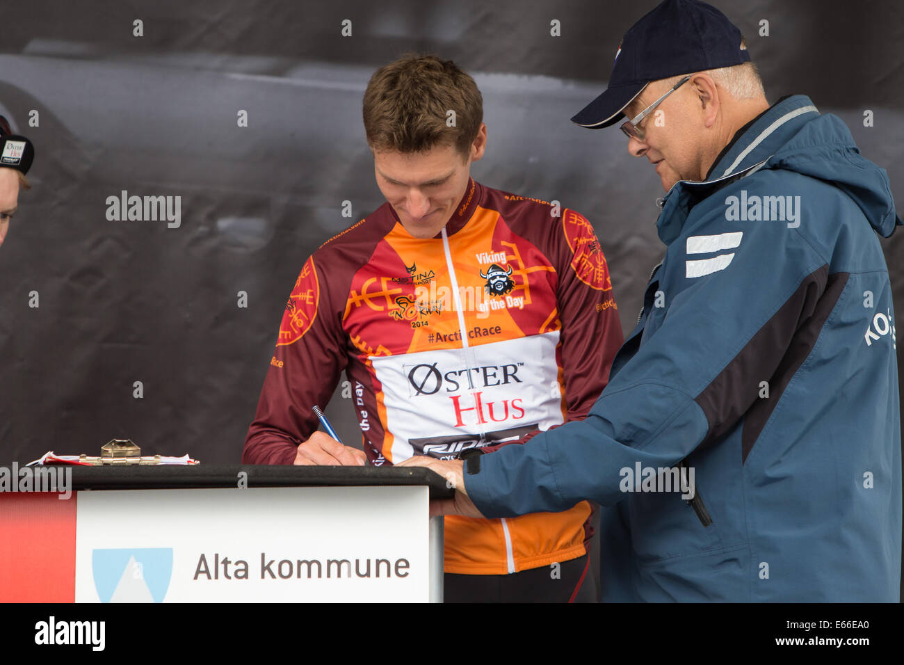 Alta 20140816, Arctic Race of Norway 2014, day 3  The owner of the Viking Jersey after day 2 signs in before start on the 3rd stage of Arctic Race of Norway. Day 3 of the race started in Alta in Finnmark and ended on the Kvaenang mountain after 132km.  Foto: Ole Reidar Mathisen Stock Photo