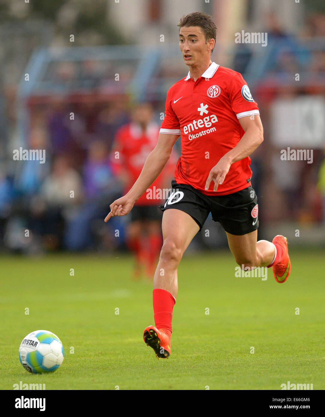 Mainz's Filip Djuricic in action during the DFB Cup first round match between Chemnitzer FC and FSV Mainz 05 in the Stadium on Gellerstrasse in Chemnitz, Germany, 15 August 2014. Photo: THOMAS EISENHUTH/dpa (ATTENTION: The DFB prohibits the utilisation and publication of sequential pictures on the internet and other online media during the match (including half-time). ATTENTION: BLOCKING PERIOD! The DFB permits the further utilisation and publication of the pictures for mobile services (especially MMS) and for DVB-H and DMB only after the end of the match.) Stock Photo
