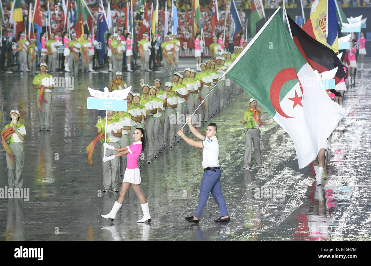 (140816) -- NANJING, Aug. 16, 2014 (Xinhua) -- The flag bearer of Algeria delegation parades into the stadium during the opening ceremony of Nanjing 2014 Youth Olympic Games in Nanjing, capital of east China's Jiangsu Province, Aug. 16, 2014. (Xinhua/Yue Yuewei) (ljr) Stock Photo