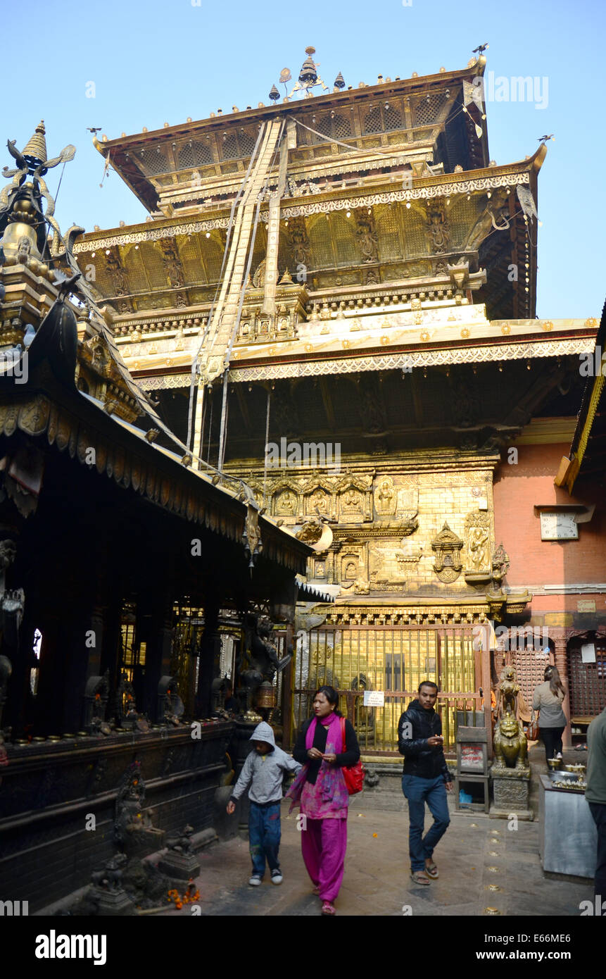 Nepalese people in Golden Temple or Hiranya Varna Mahavihar pagoda in Patan Durbar Square is situated at the centre of Lalitpur Stock Photo