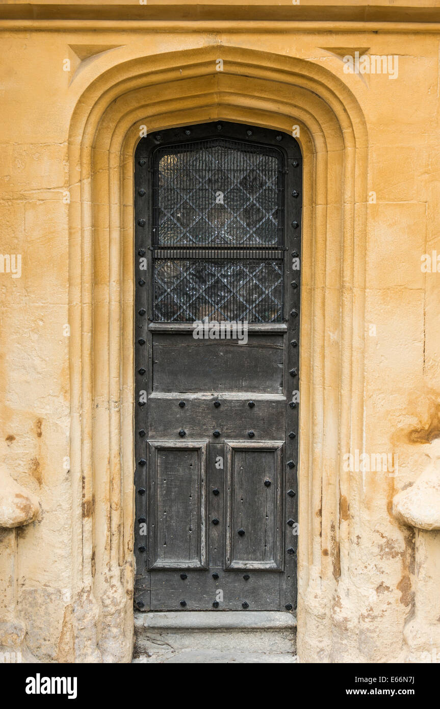 Ornate wooden door from a section of the south porch of the Church of St John Baptist, Cirencester, Cotswolds, Gloucestershire, England, UK. Stock Photo