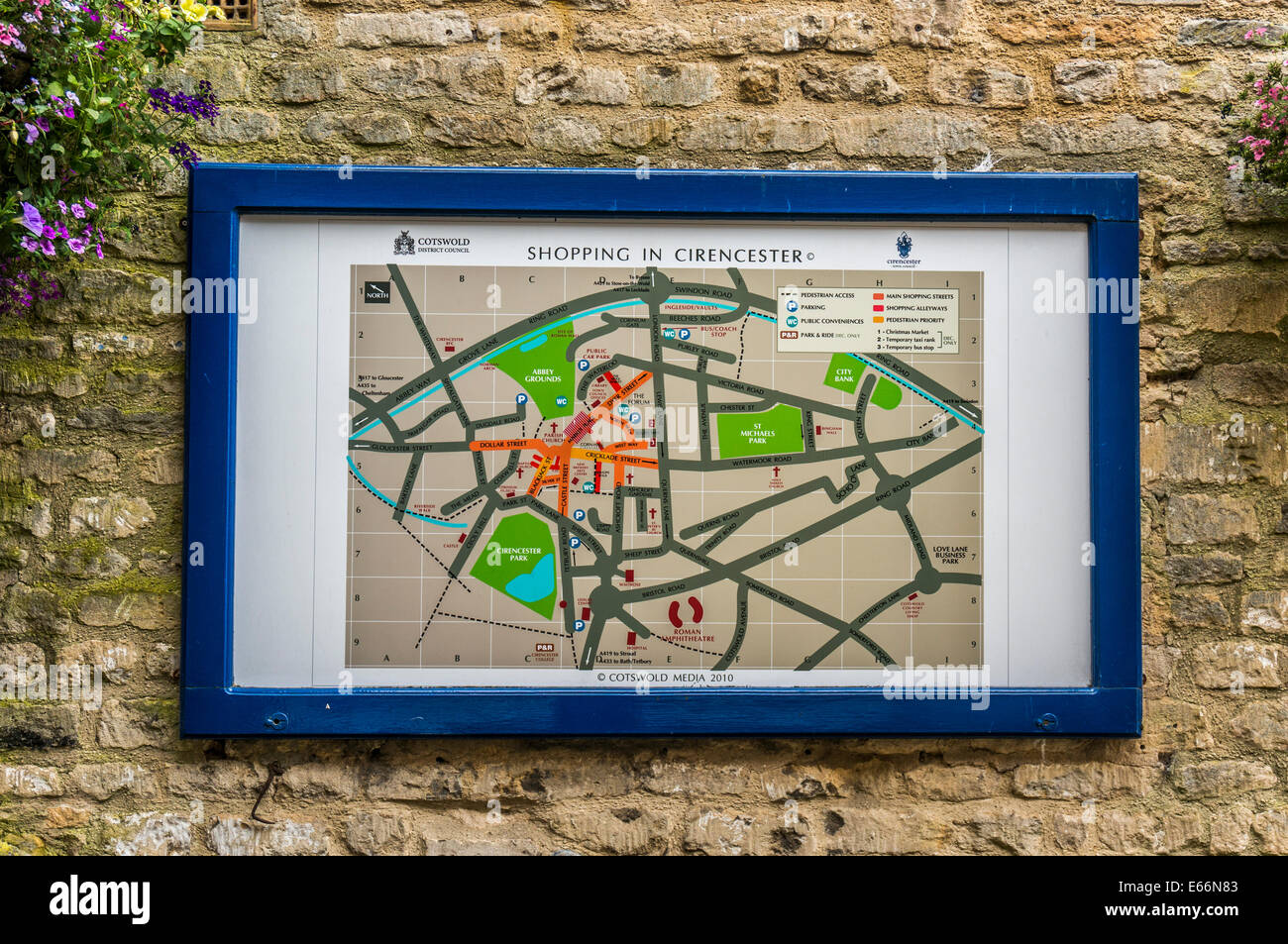 A framed shopping map, attached to a stone wall, in Cirencester town centre, Cotswolds, Gloucestershire, England, UK. Stock Photo