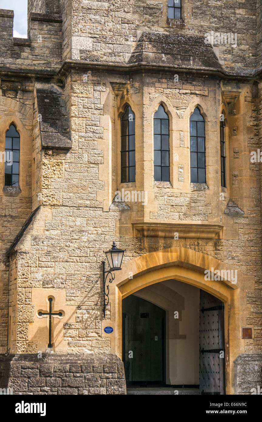 Entrance to historic Cecily Hill Barracks (faux medieval castle), near Cirencester Park, in the Cotswolds, Gloucestershire, England, UK. Stock Photo