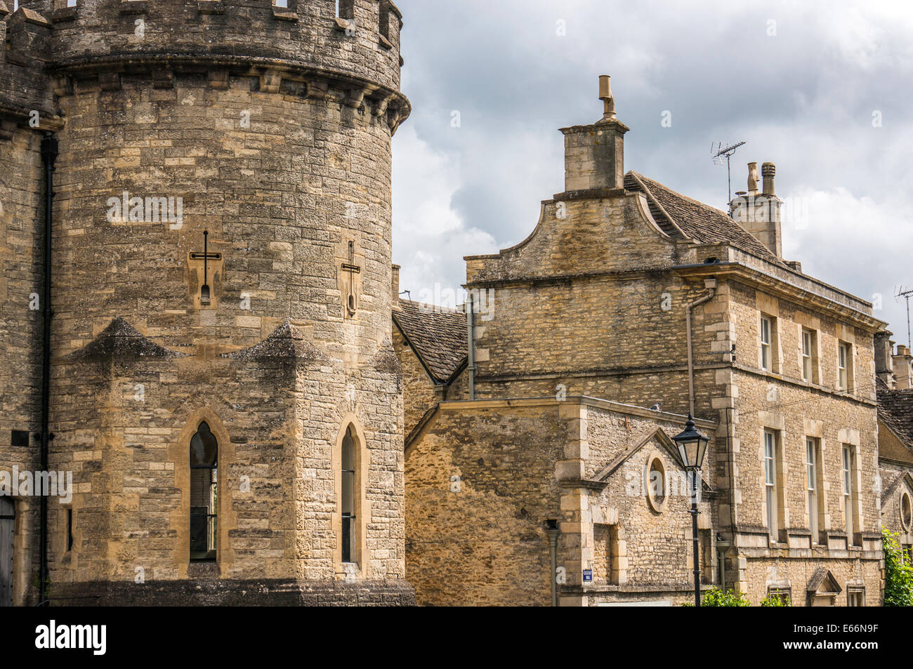 Historic Cecily Hill Barracks (faux medieval) castle, at the entrance to Cirencester Park, in the Cotswolds, Gloucestershire, England, UK. Stock Photo