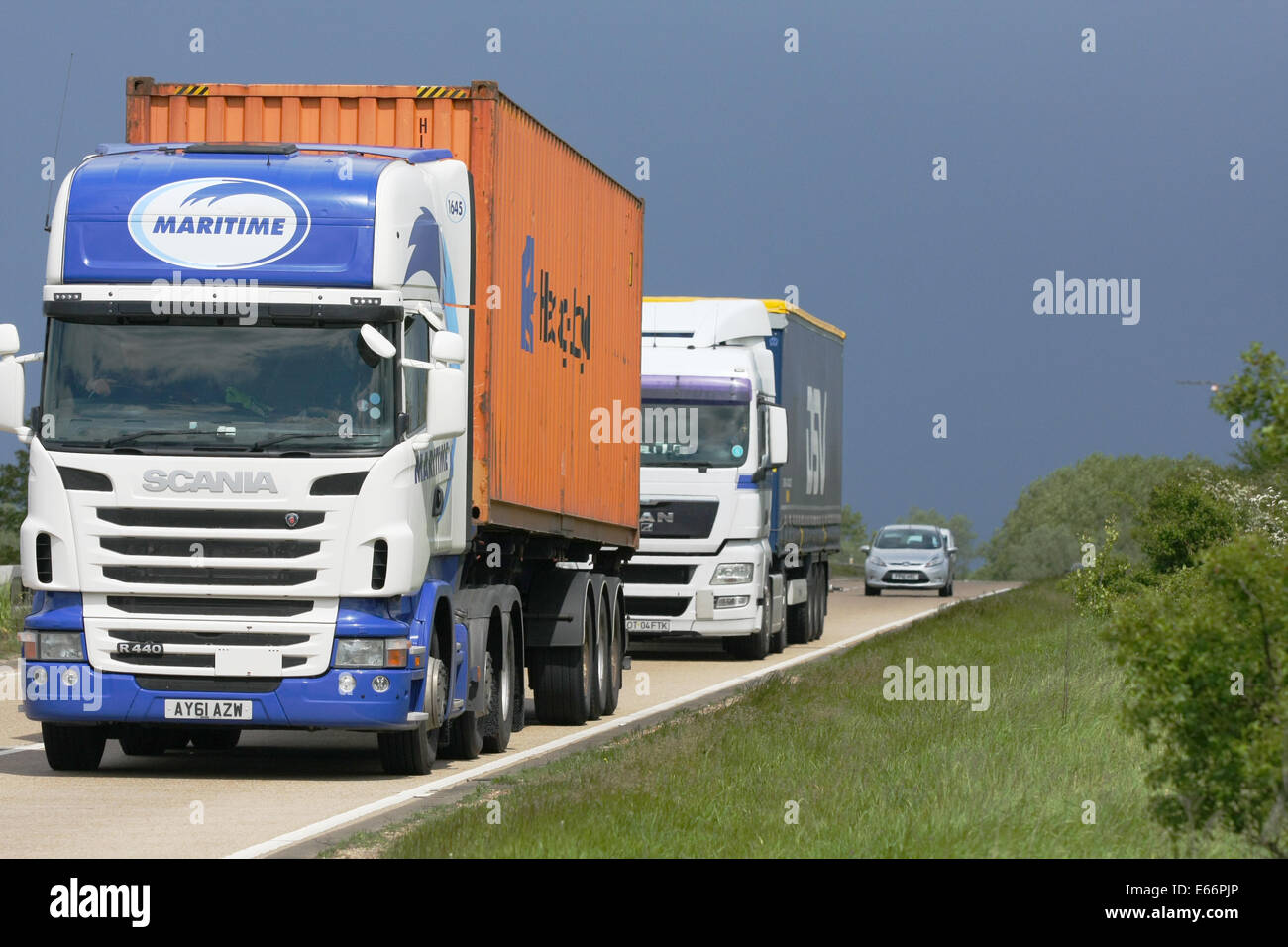 trucks traveling along the A12 dual carriageway in Essex, England. Stock Photo