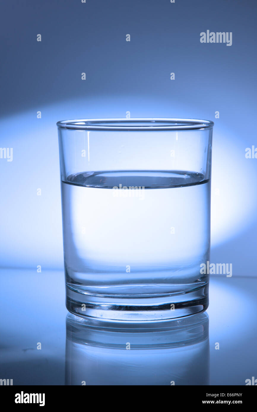 Glass of water toned in blue color Stock Photo