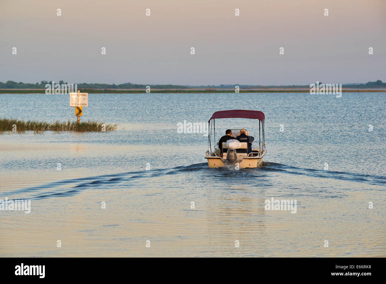Boat sailing into Lake Tohopekaliga in Kissimmee central Florida Stock