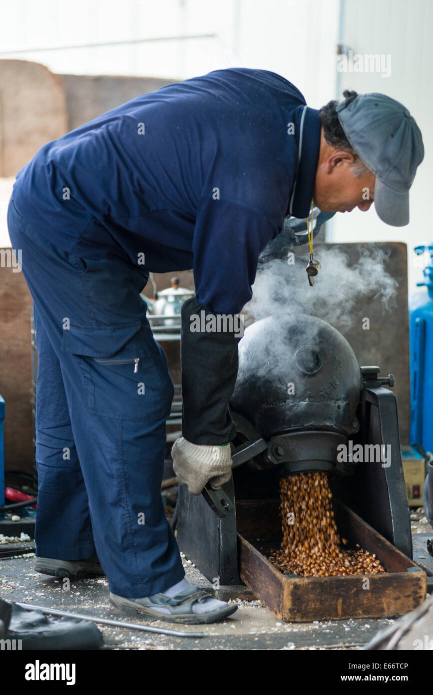 Traditional Popcorn maker and vendor in action, Busan, South Korea. Stock Photo