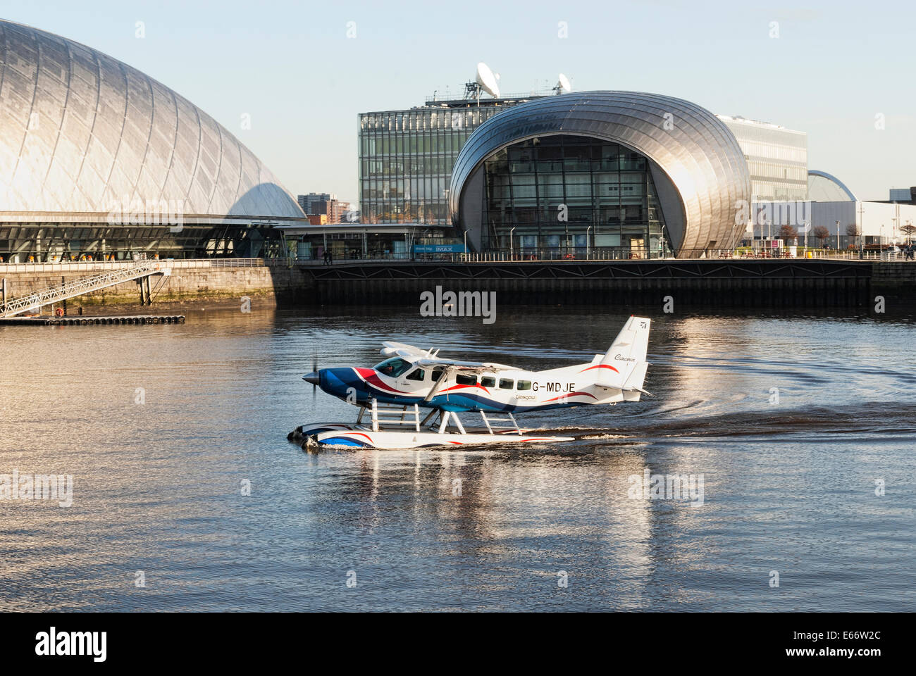 Seaplane taking off at Glasgow Science Centre. Stock Photo