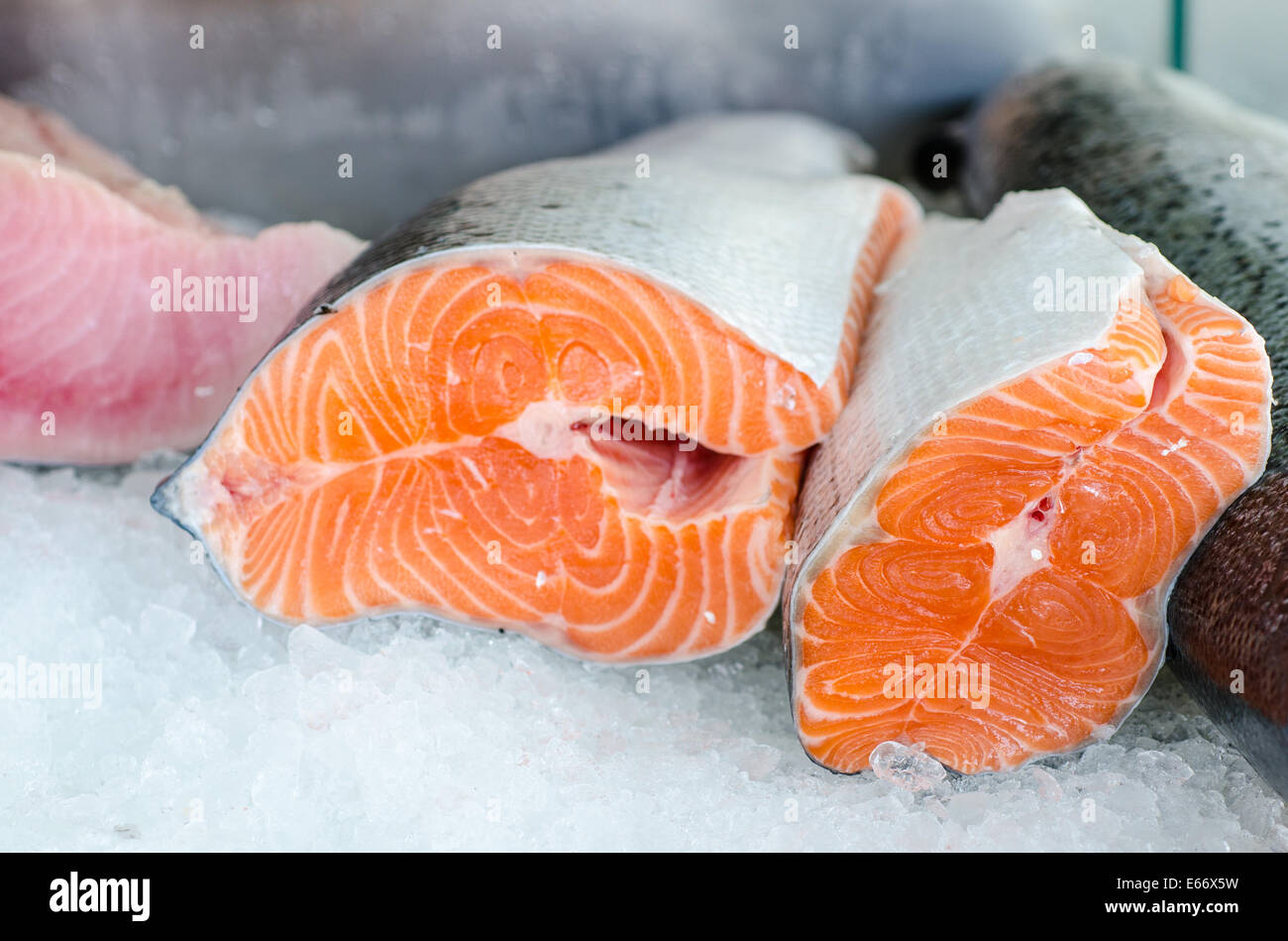 raw salmon fillet on ice of market desk Stock Photo - Alamy