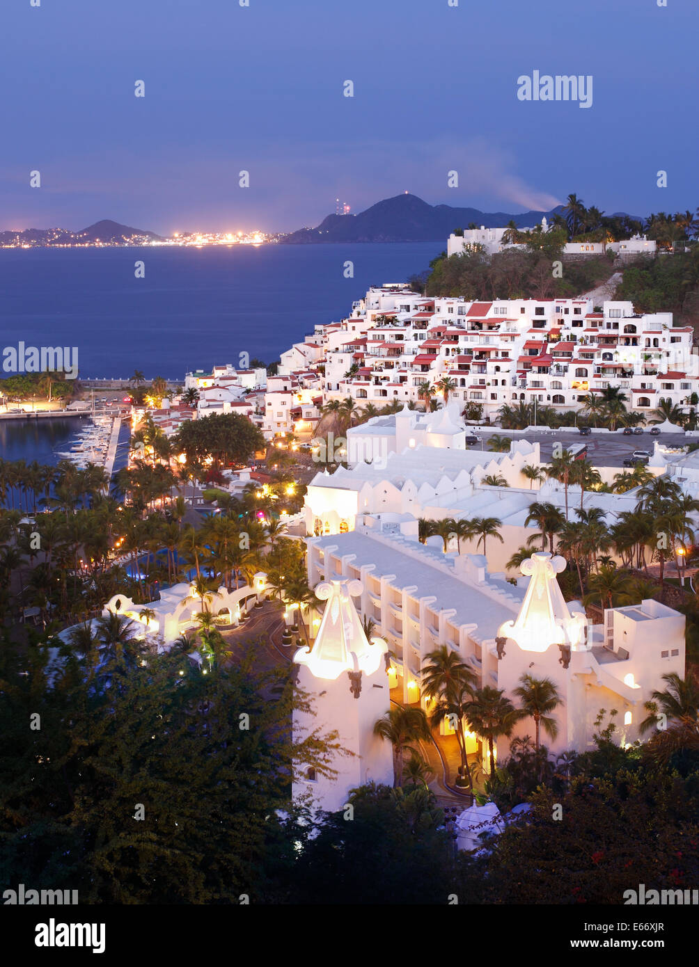 Las Hadas Resort at Twilight with Santiago Bay and the Town of Manzanillo, Colima, Mexico in the background. Stock Photo
