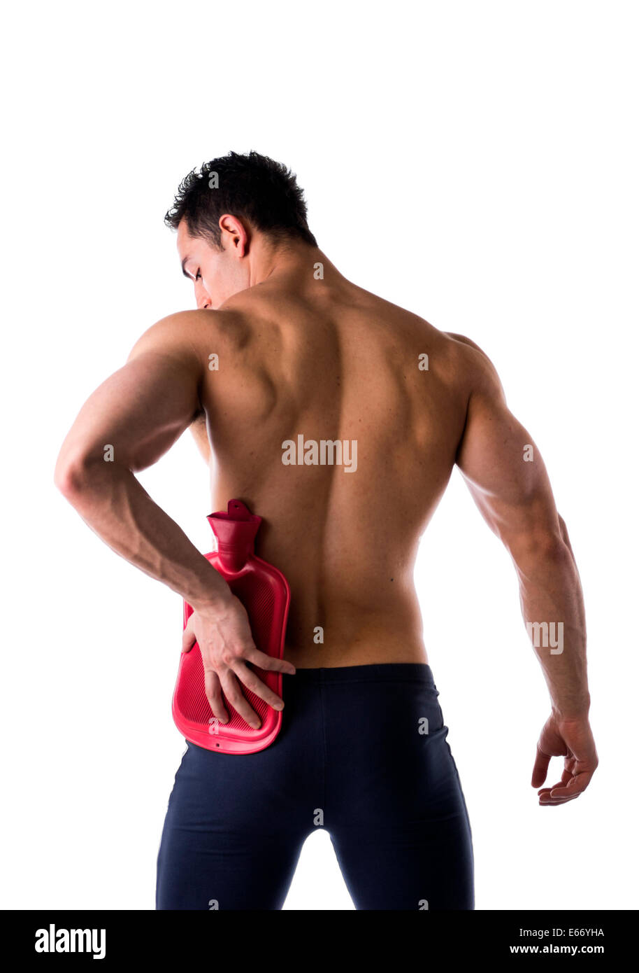 Back of young man with hip or kidney pain, holding hot water bottle