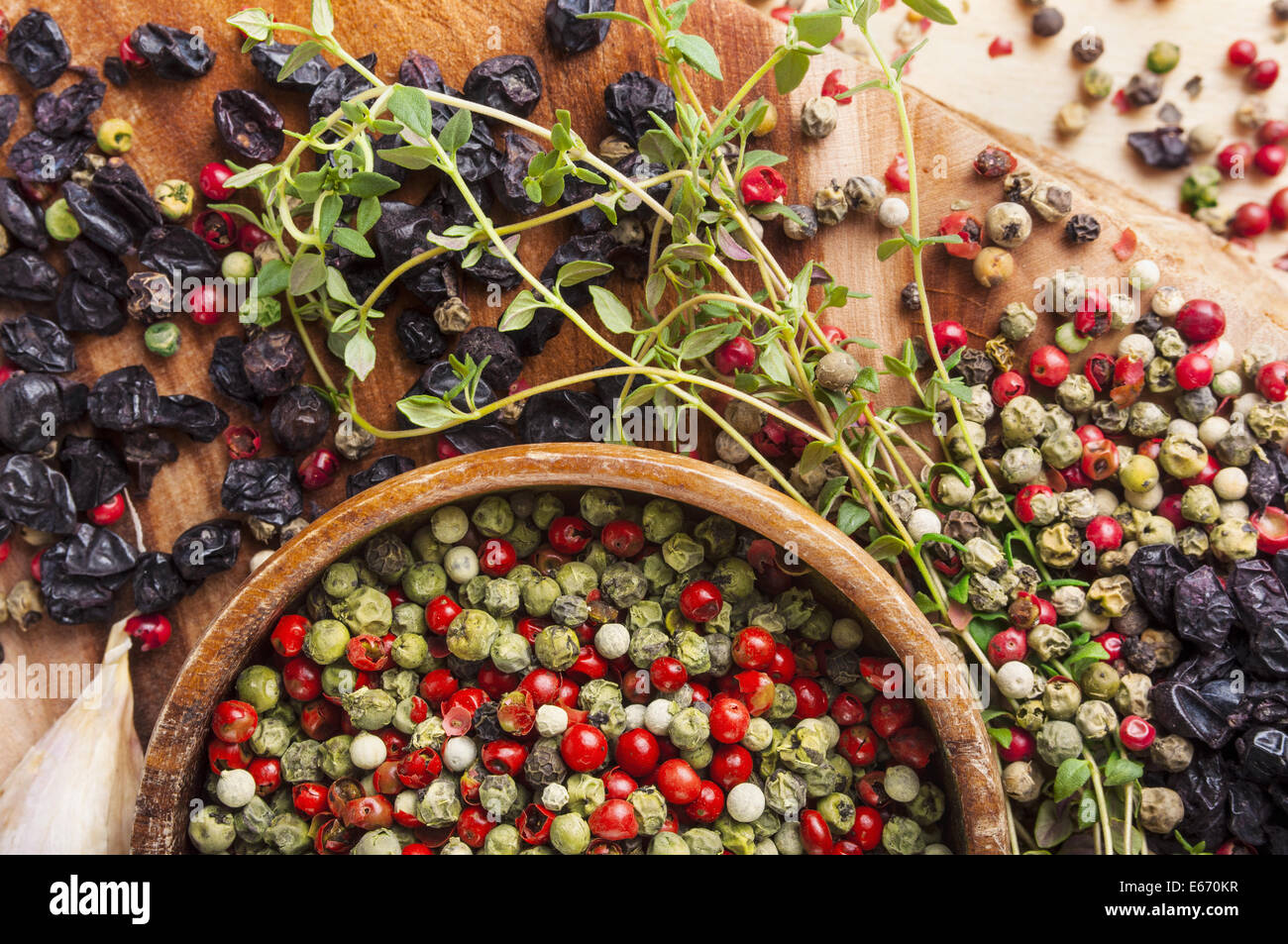 Peppercorn mix in wooden bowl, herbs and spices Stock Photo Alamy