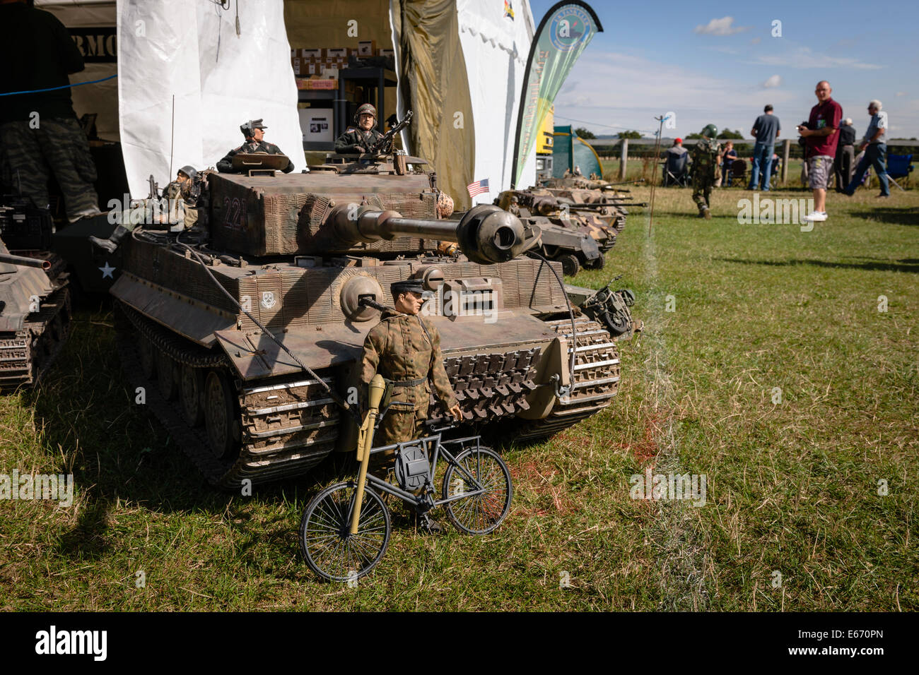 Kent, UK. 16th Aug, 2014. Miniature Tanks and soldiers on display at The 6th Annual Combined Ops Show at Headcorn Airfield. Featuring fly-overs, war re-enactments, fancy dress, actual and replica memorabilia, and more. Credit:  Tom Arne Hanslien/Alamy Live News Stock Photo