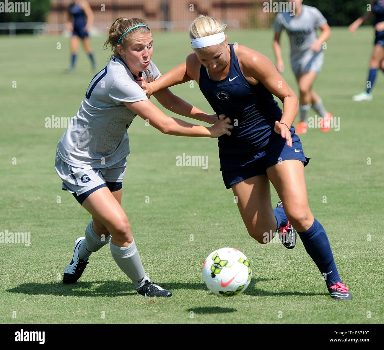 Washington, DC, USA. 16th Aug, 2014. 20140816: Penn State midfielder Emily Hurd (3), right, breaks around Georgetown midfielder Rachel Corboz (20) in the second half of an exhibition match at Shaw Field in Washington. © Chuck Myers/ZUMA Wire/Alamy Live News Stock Photo