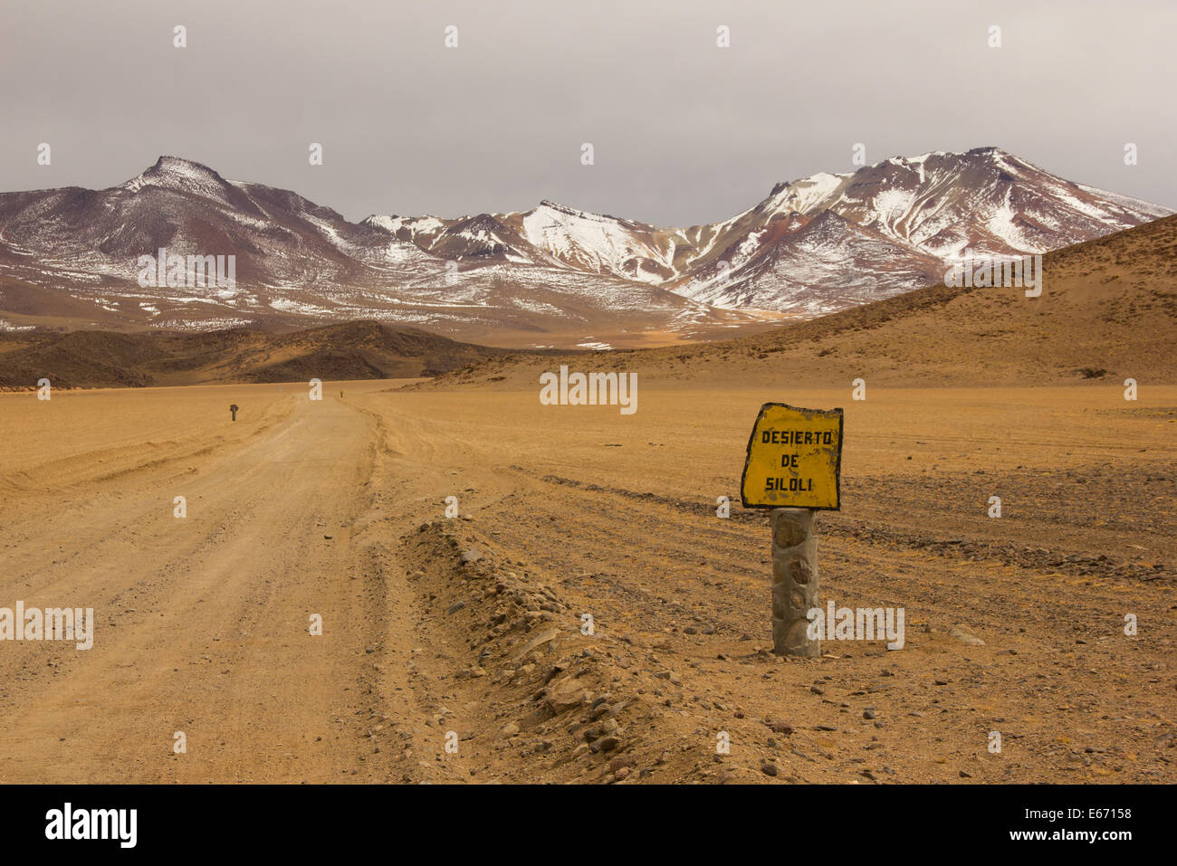 Siloli Desert sign and road in south Bolivia with Stock Photo