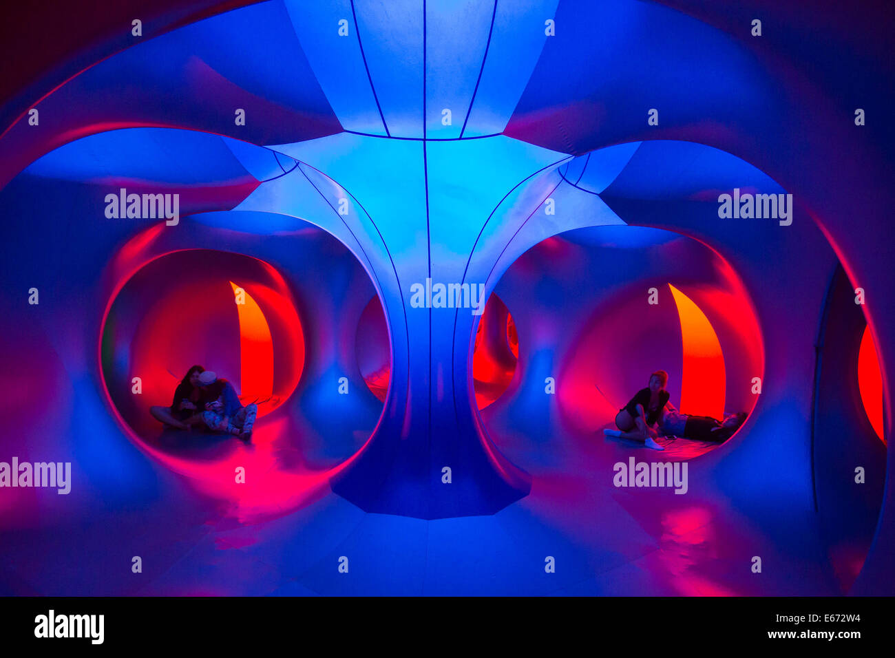 Budapest. 16th Aug, 2014. Festival goers rest in the colour lights of a Luminarium during the Sziget (Hungarian for 'Island') Festival on the Obuda Island in Budapest, Hungary on Aug. 16, 2014. The 22nd edition of the Sziget Festival lasts from August 11 to August 17. It is one of the largest music festivals in Europe, attracting nearly 400,000 people every year. Credit:  Attila Volgyi/Xinhua/Alamy Live News Stock Photo