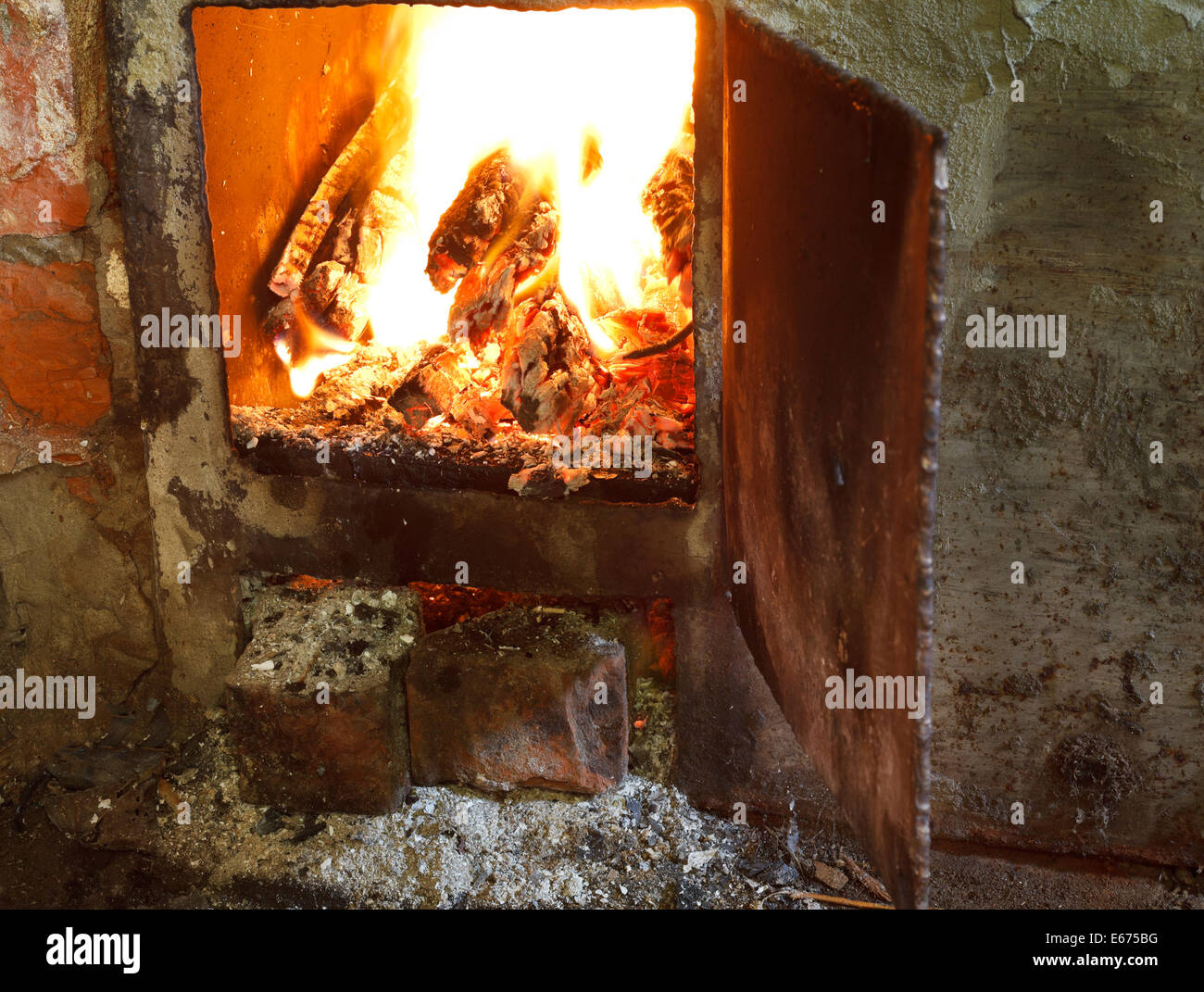 Flame Of Burning Wood In Furnace With Open Door Stock Photo