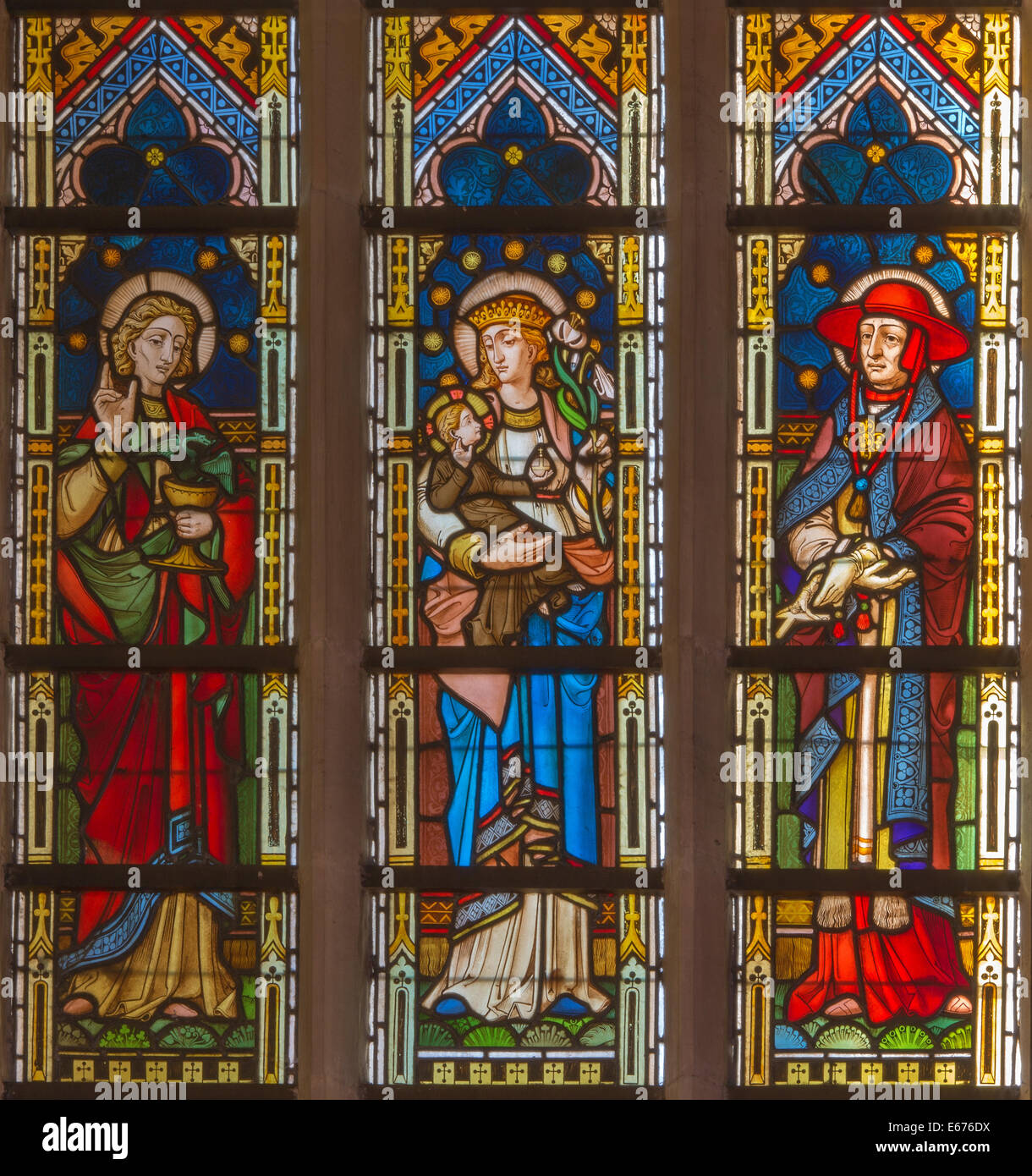 BRUGES, BELGIUM - JUNE 13, 2014: Madonna with the saints on the windowpane in st. Giles church (Sint Gilliskerk) Stock Photo