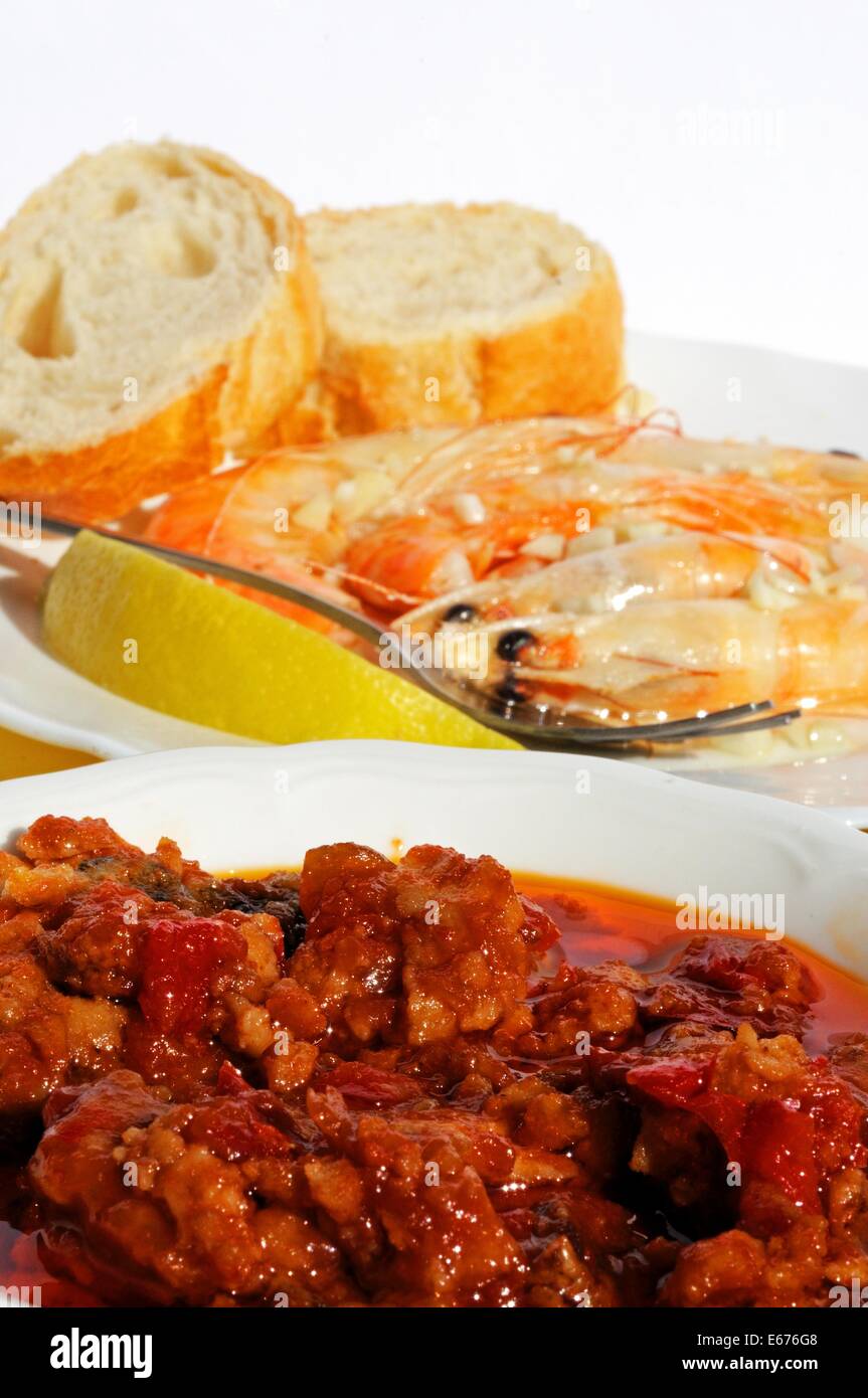 Tapas selection cod in Biscay sauce and King prawns with garlic and ...