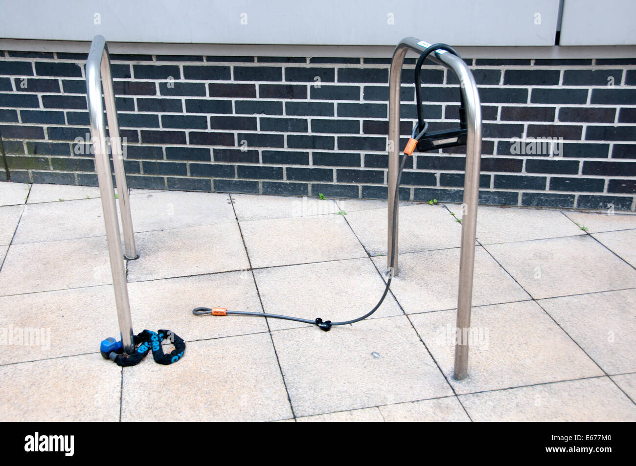 Hackney Central Library bicycle racks with locks left behind after bikes were stolen. Stock Photo