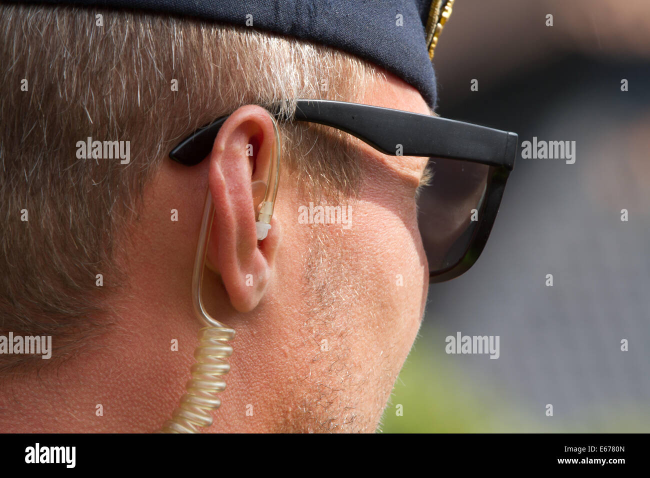 Swedish policeman with an earpiece Stock Photo