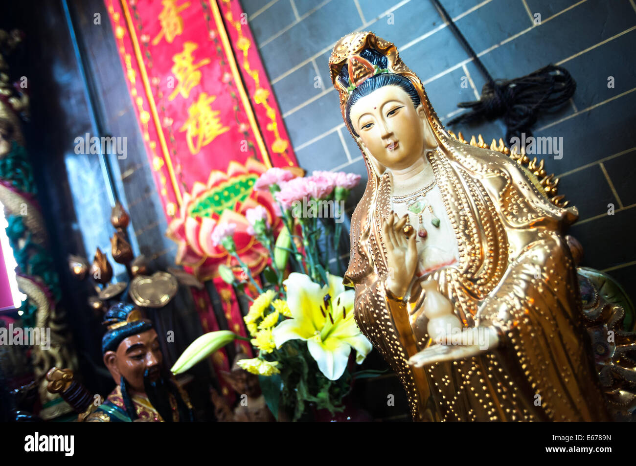 Statue of Guanyin, the Goddess of Mercy, at a Hong Kong temple Stock Photo