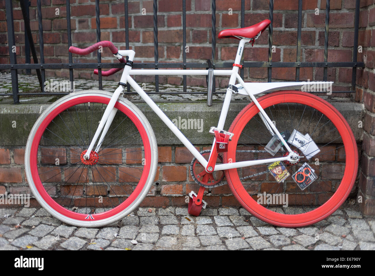 The bike with red bonnet,wheels,saddle and white chassis Stock Photo