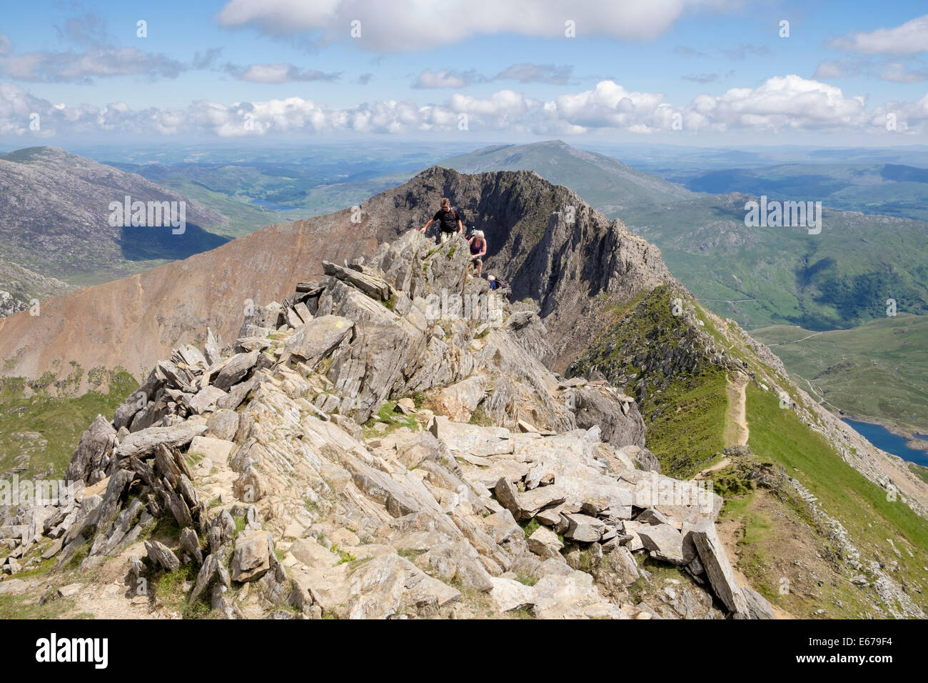 Hikers Scrambling On Crib Y Ddysgl With View Back To Crib Goch