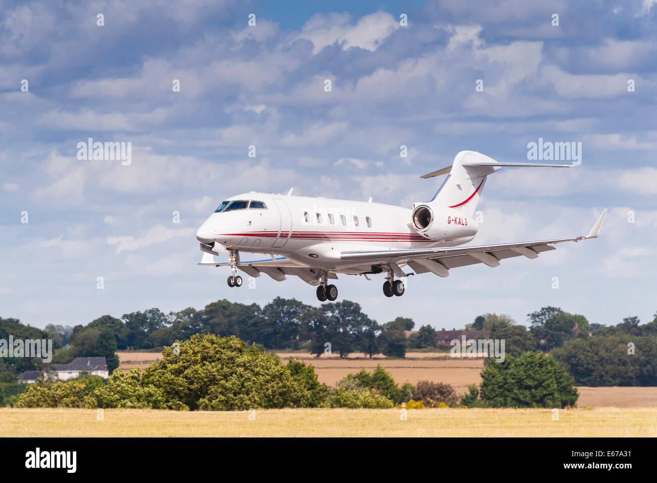 A plane Bombardier Challenger 300 (G-KALS) landing at Luton Airport in England , Britain , Uk Stock Photo