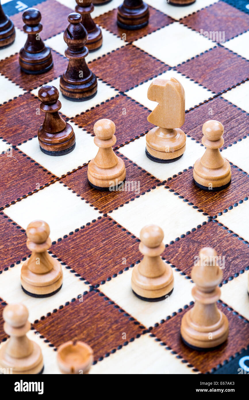 Wooden chess pieces on the board Stock Photo