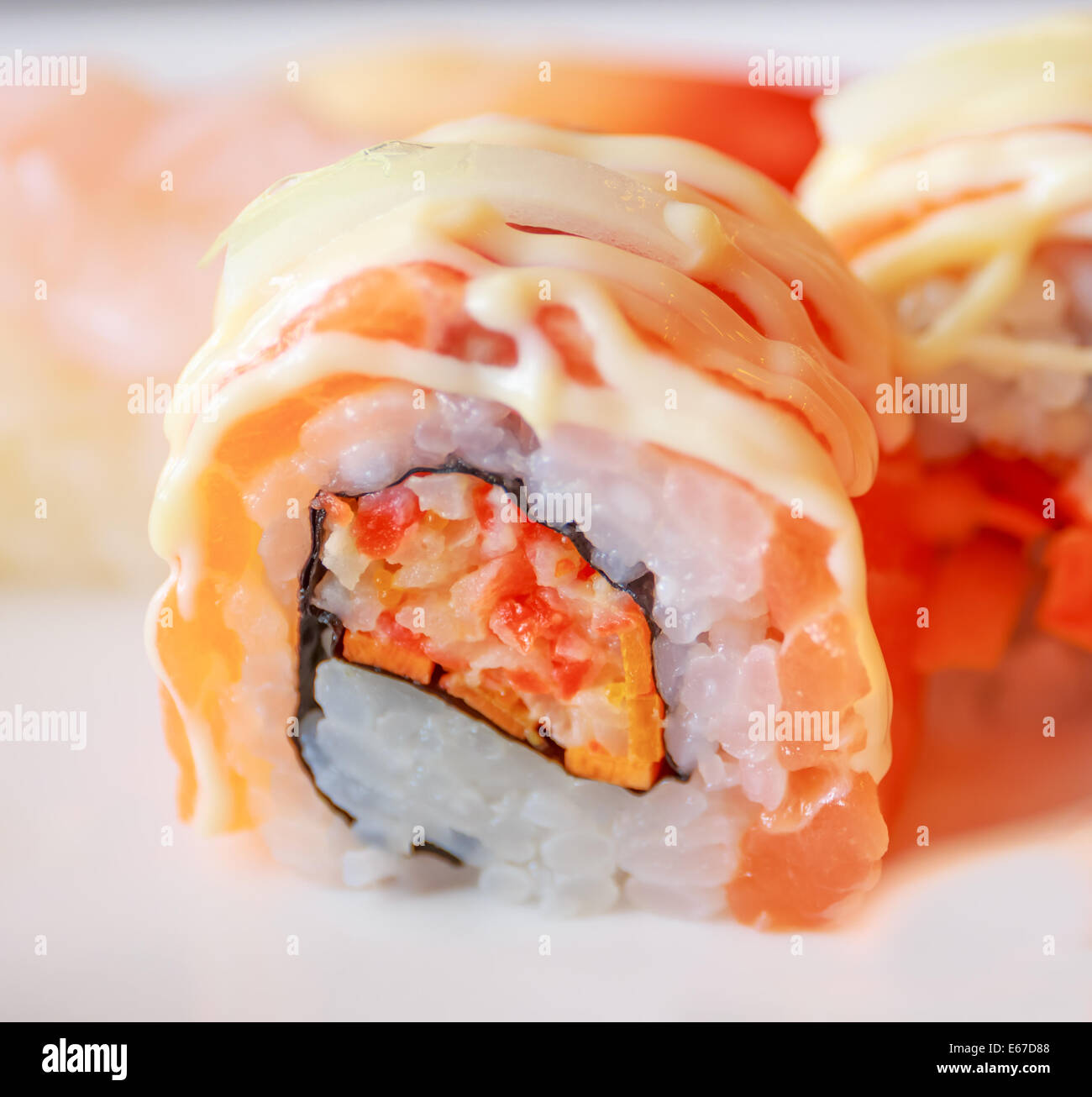 A closeup shot of raw salmon roll sushi, a popular japanese food Stock Photo