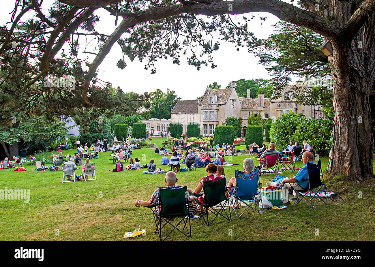 Visitors enjoy a picnic before an outdoor Shakespeare performance at Tolethorpe Hall, Lincolnshire England Stock Photo
