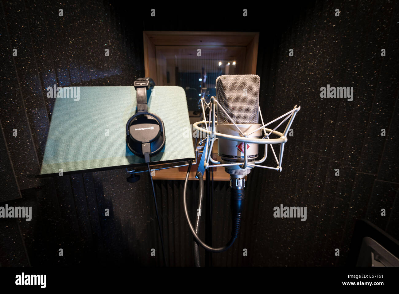 A neuman microphone in a vocal booth in a music recording studio Stock Photo